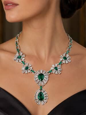 Vintage Emerald Green Swarovski Crystal Starburst Bib Necklace styled on an editorial fashion model wearing a black off-shoulder gown